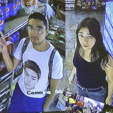 Micaela Durand, a thirty-something Latina woman, and Daniel Chew, a thirty-something Asian man, stand in the aisle of a deli amid a colorful assortment of snacks as seen from a security camera.
